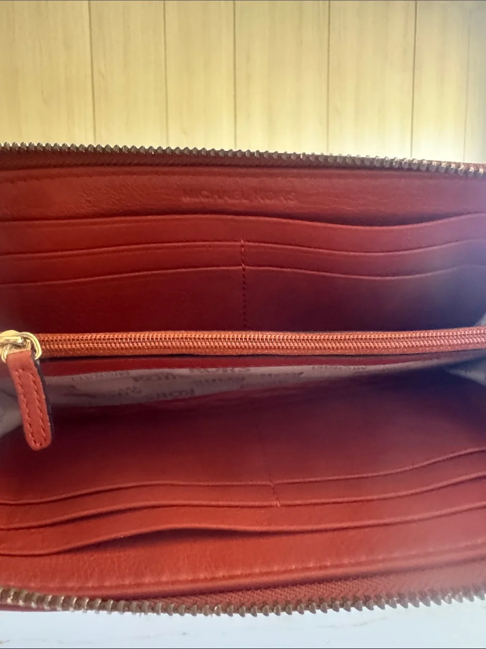 Michael Kors Brick Red Leather Zip-Around Wallet with Gold Plaque